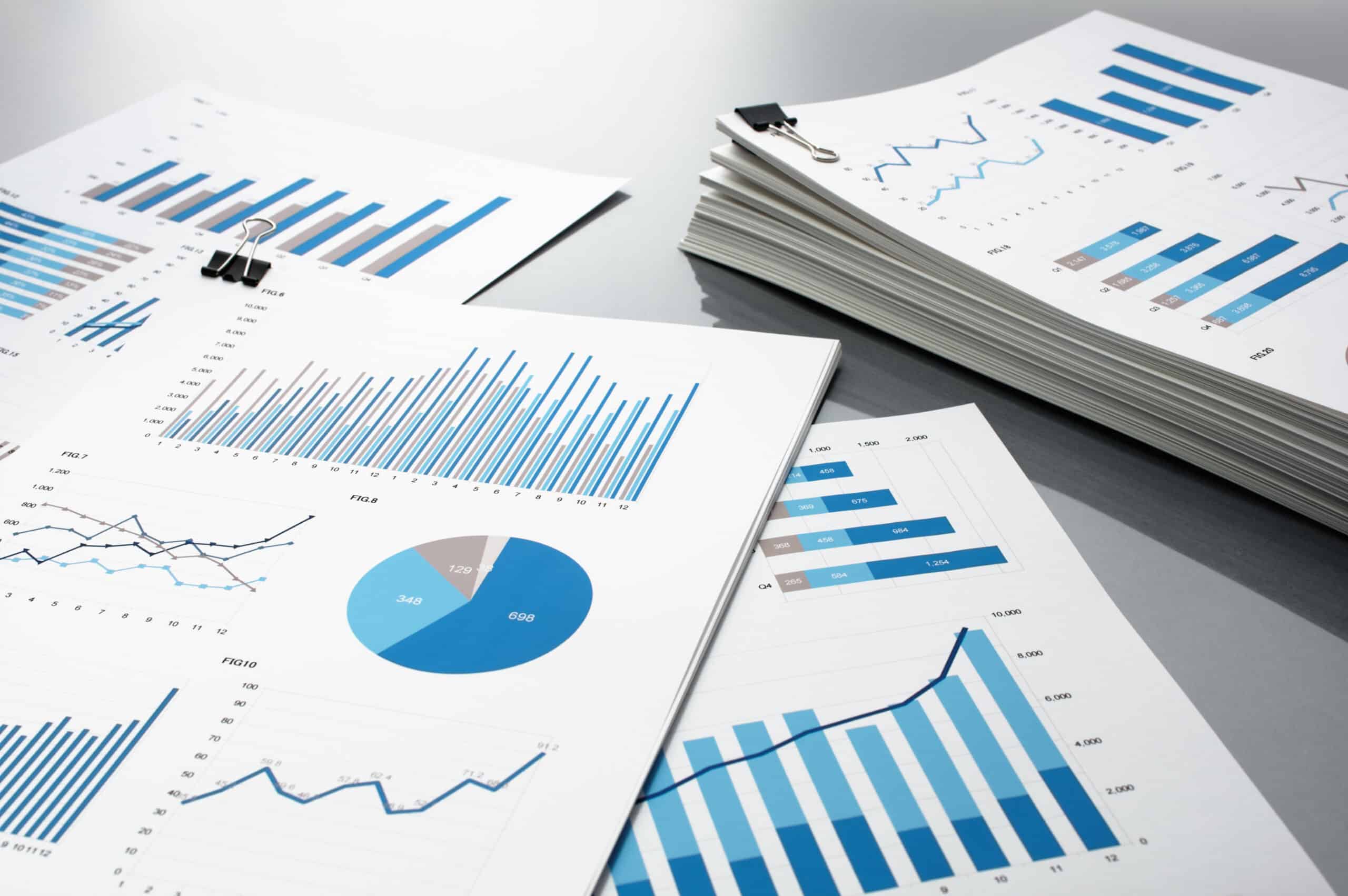 Preparing report. Blue graphs and charts.